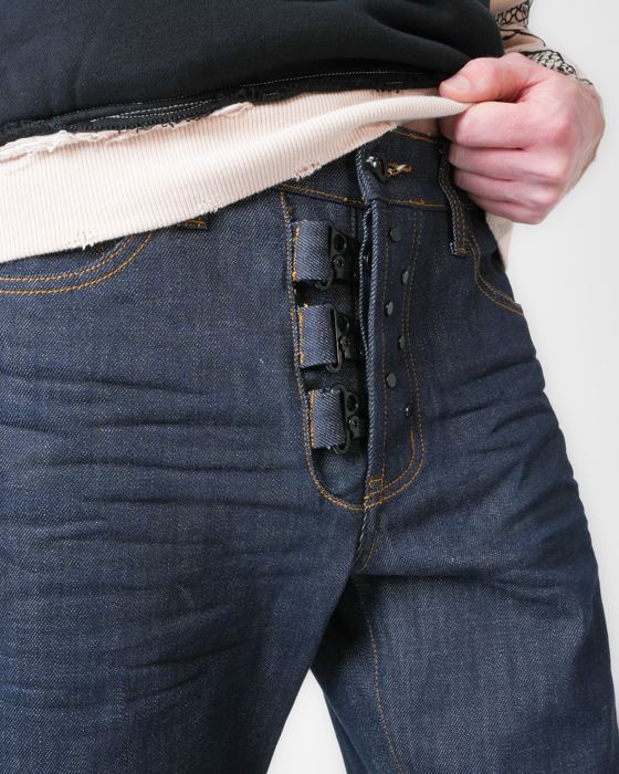Exposed hardware button fly on raw denim